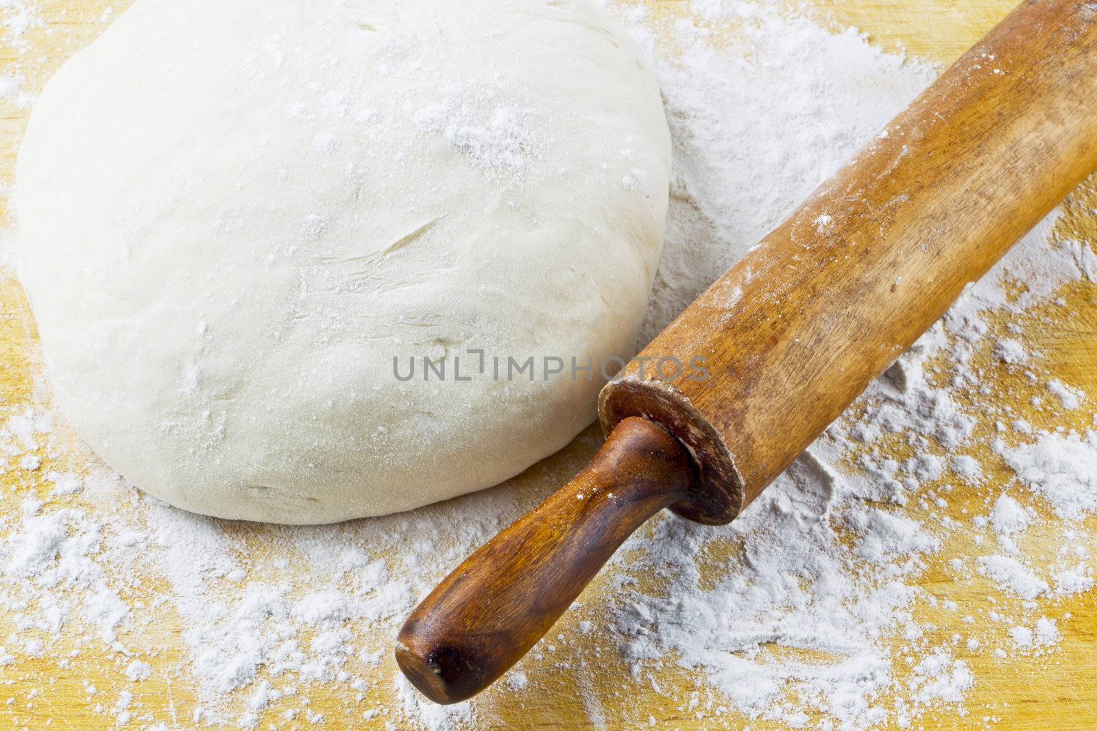 rolling pin with pizza dough by kozzi