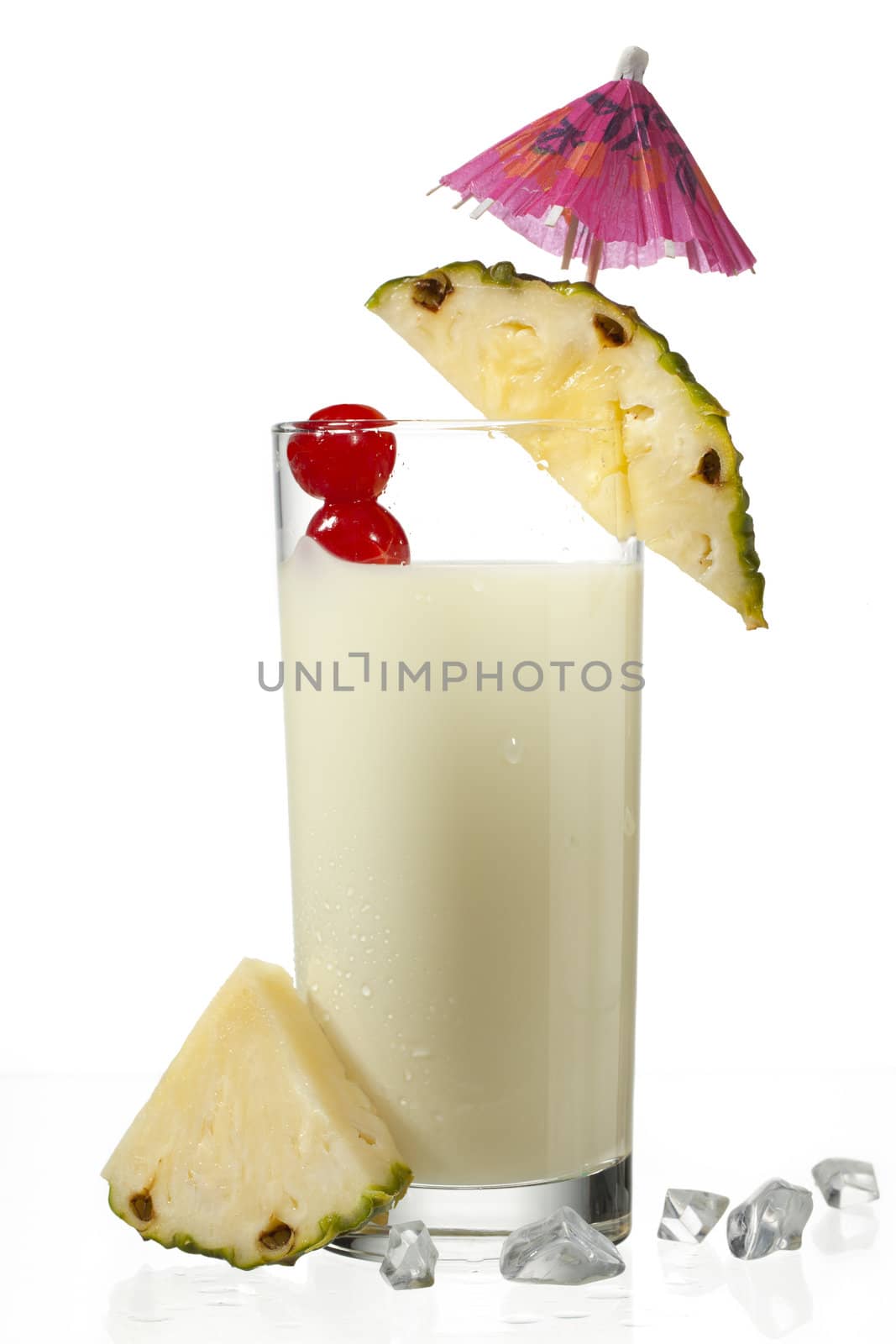 view of pineapple milkshake decorated with slice isolated on a white background