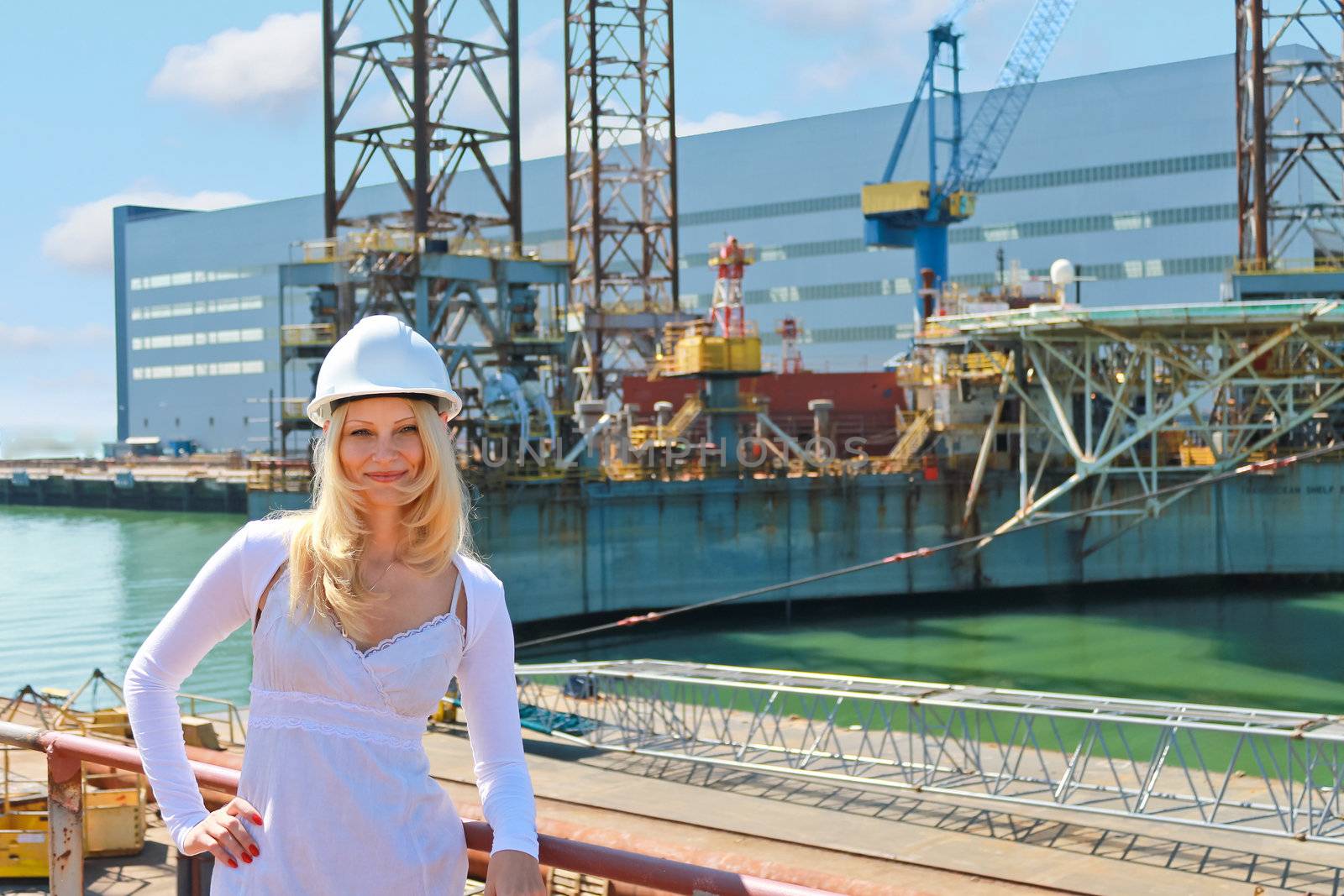 Woman engineer shipbuilder at the shipyard. by NickNick