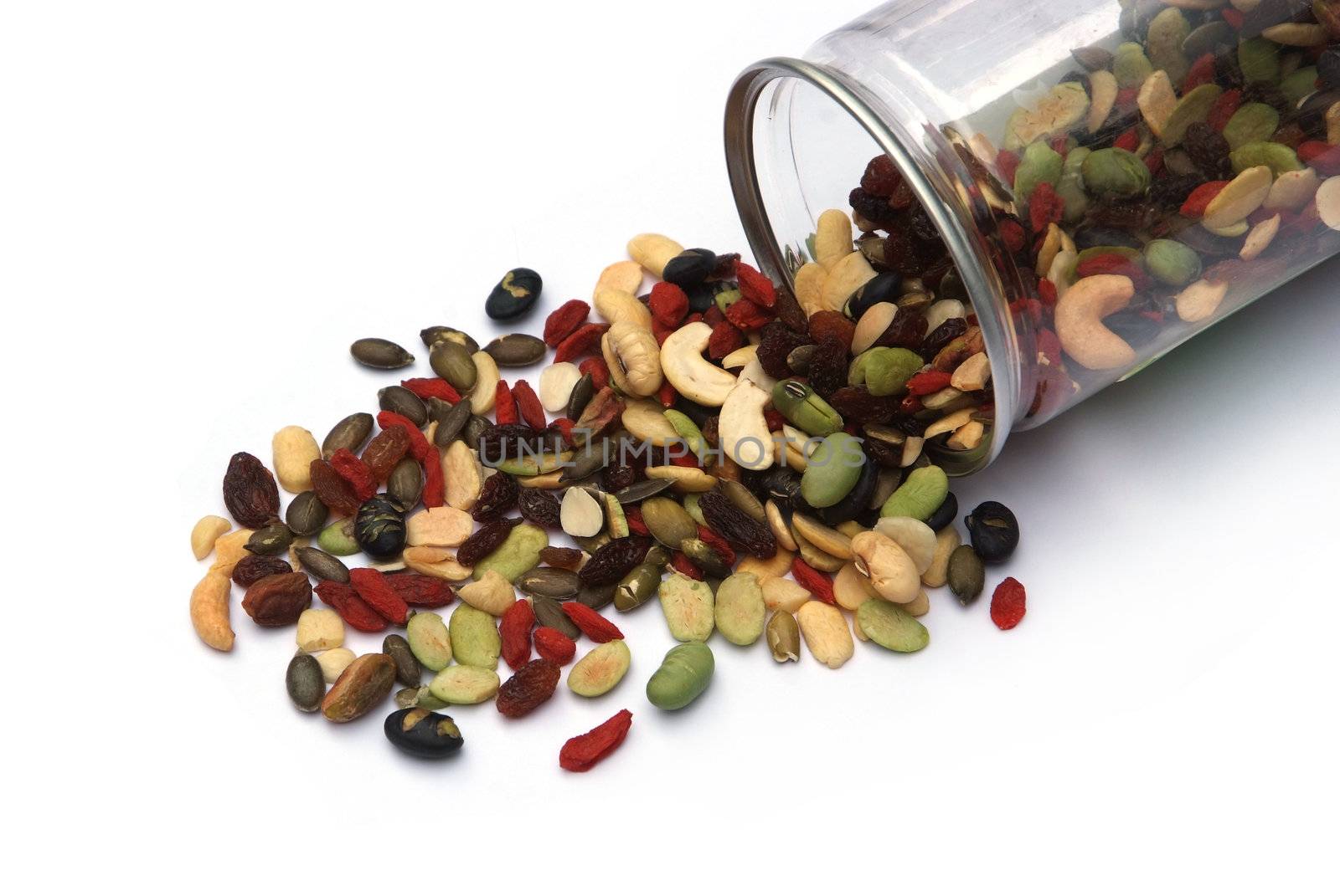 organic mixed nuts and dry fruits on white background