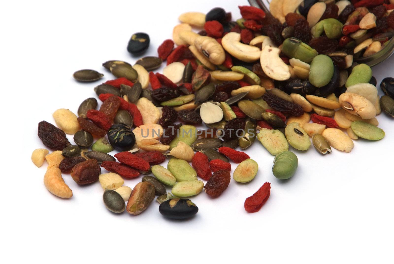 organic mixed nuts and dry fruits on white background