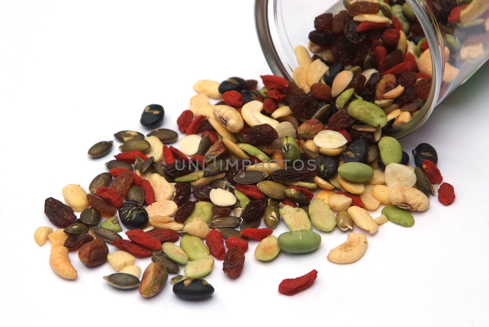 organic mixed nuts and dry fruits on white background