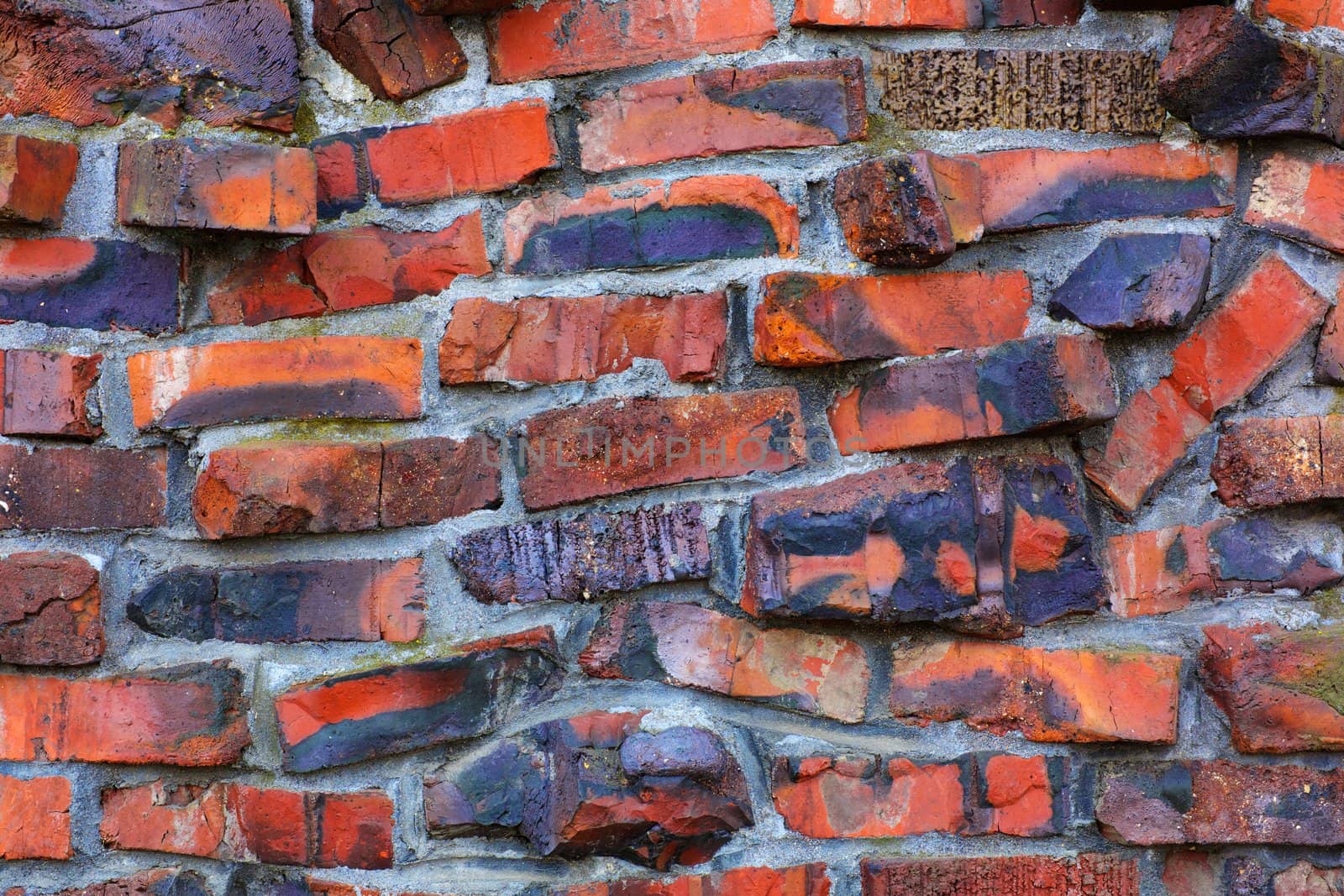 Oddly shaped, fired, and multi-color red  wall of klinker brick