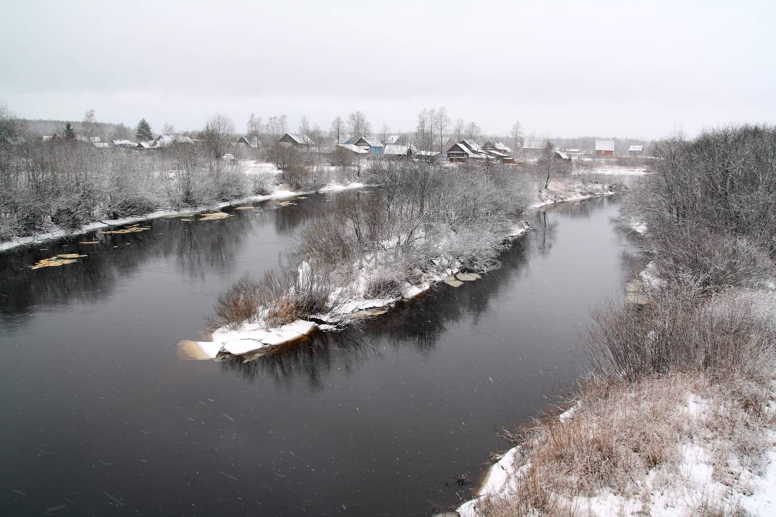 snow village on coast river