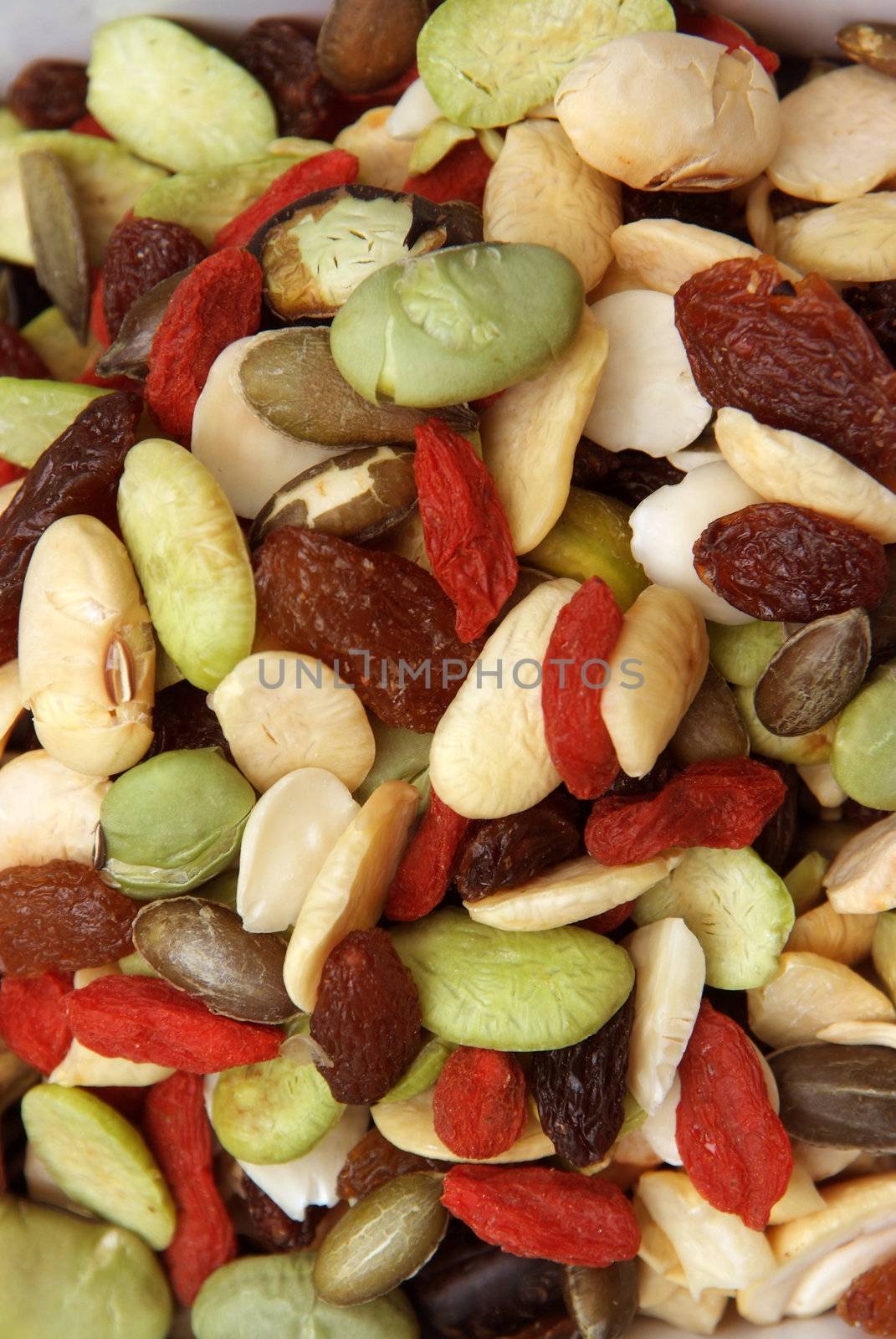 closeup organic mixed nuts and dry fruits  by opasstudio