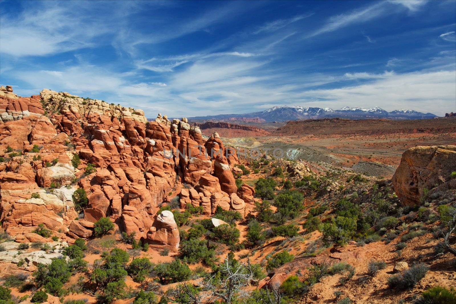 Arches National Park near hells kitchen with whispy cirrus clouds