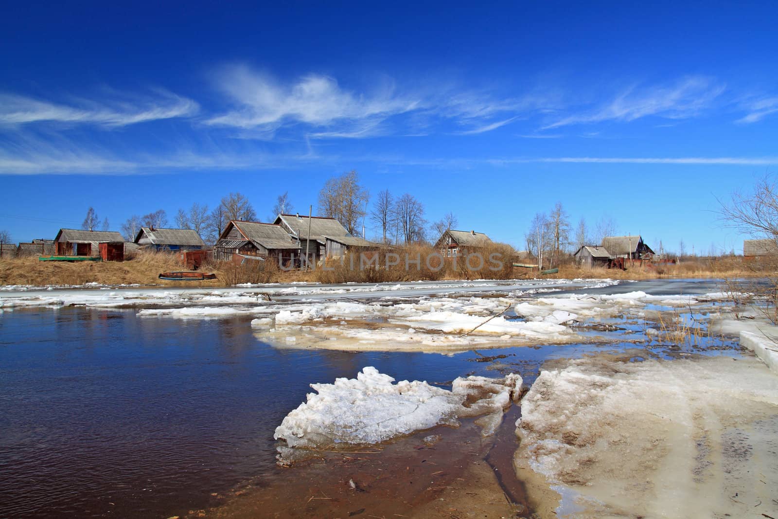 village on coast autumn river