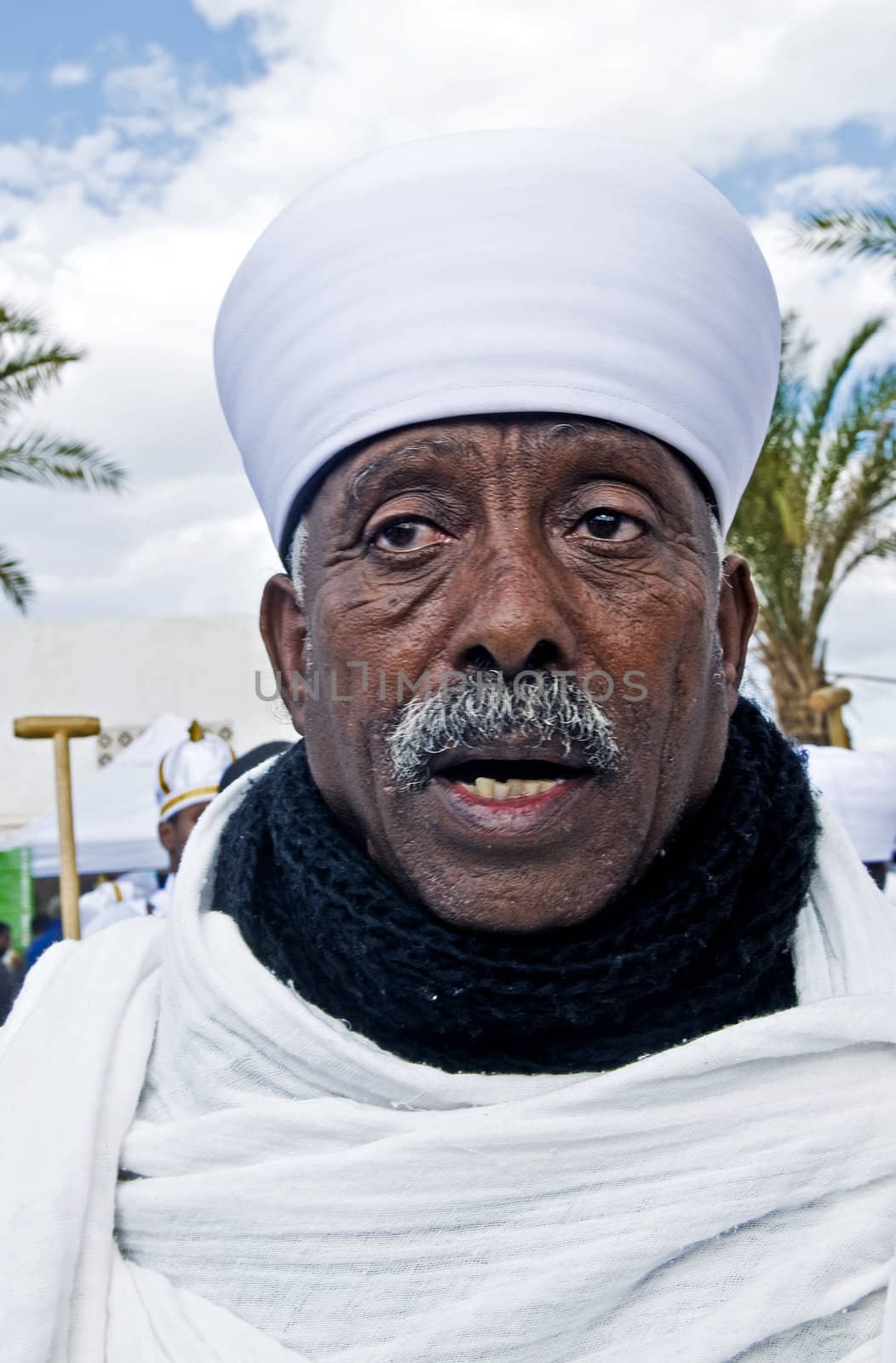 QASER EL YAHUD , ISRAEL - JAN 19 : Ethiopian Orthodox priest participates in the annual baptising ceremony during the epiphany at Qaser el yahud , Israel in January 19 2012