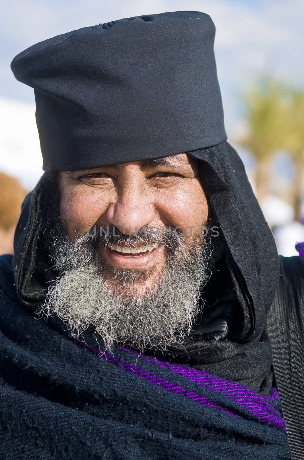 QASER EL YAHUD , ISRAEL - JAN 19 : Ethiopian Orthodox priest participates in the annual baptising ceremony during the epiphany at Qaser el yahud , Israel in January 19 2012