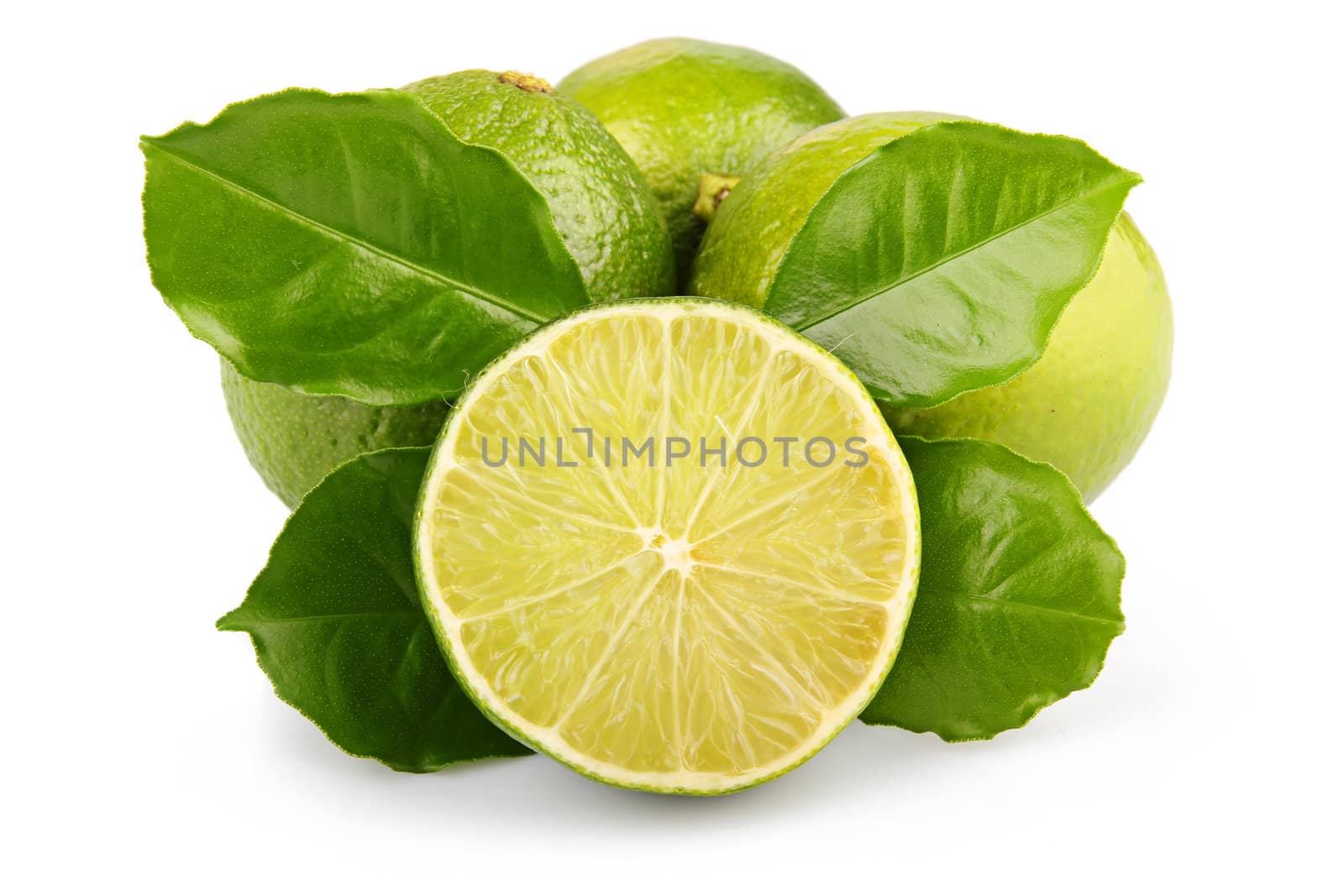 Ripe lime fruits with green leaves isolated on white background 