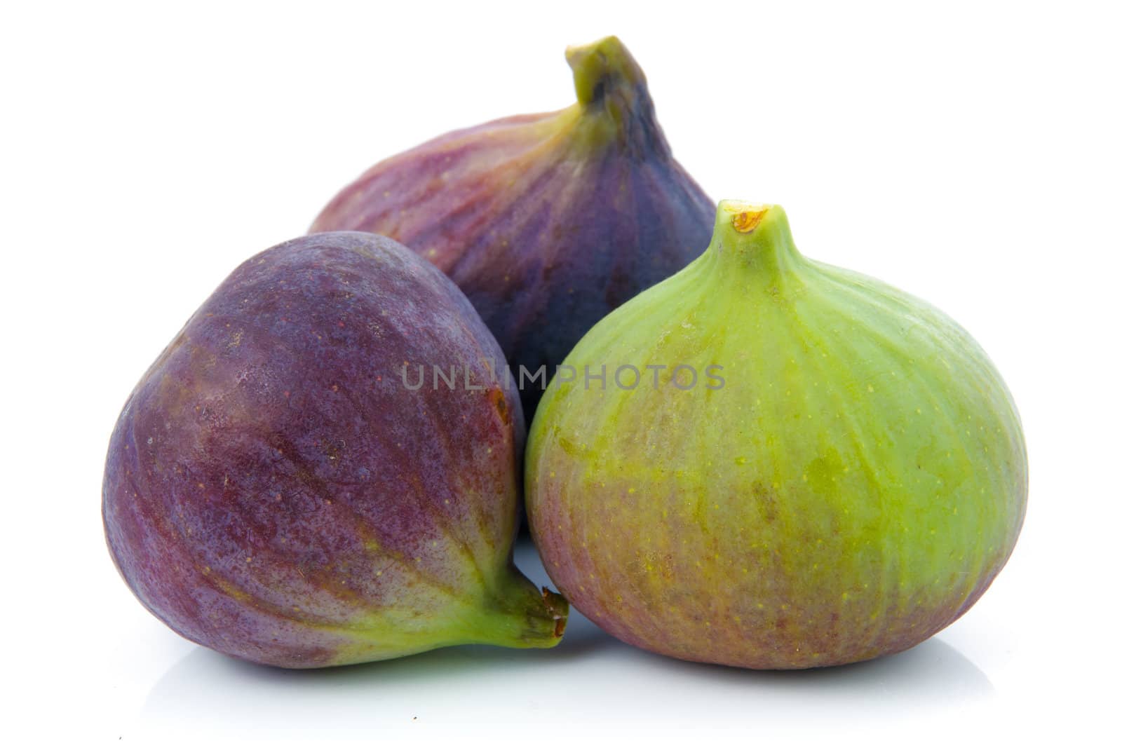 Ripe purple and green fig fruit isolated on white background 