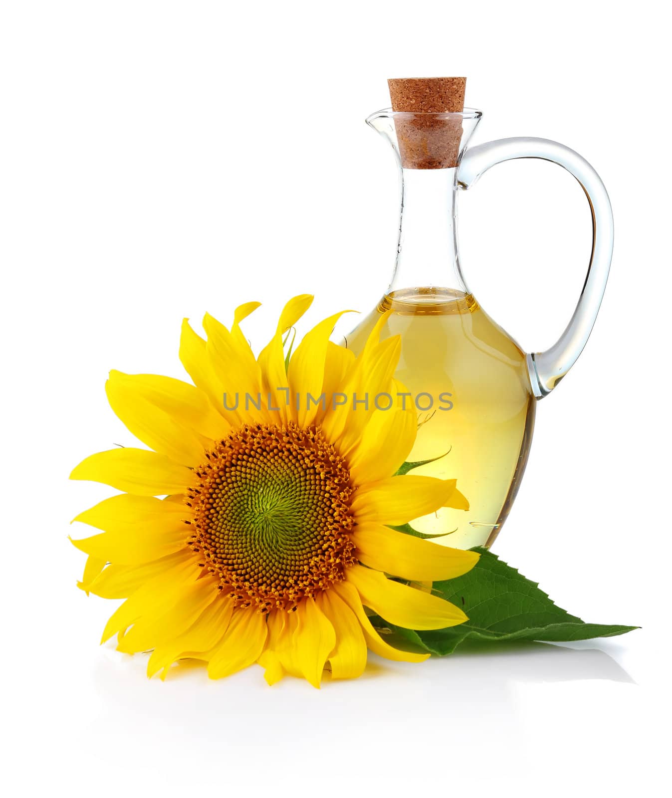 Jug sunflower oil with flower isolated on white background