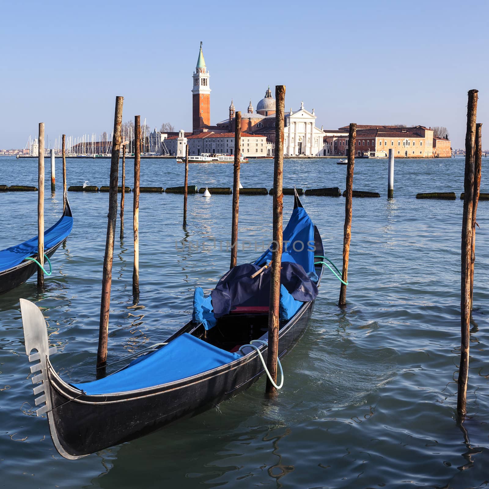 Famous view of San Giorgio maggiore with gondolas by vwalakte