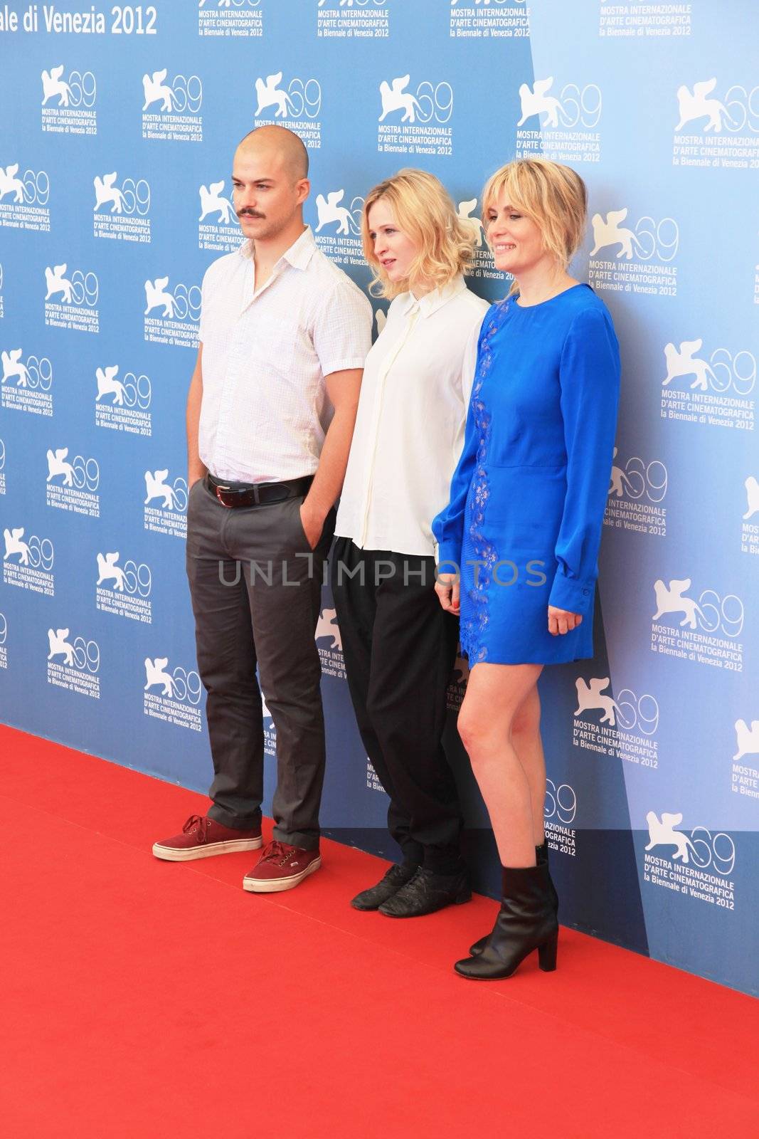 Marc Andre Grondin, Christa Theret and Emmanuelle Seigner pose for photographers at 69th Venice Film Festival