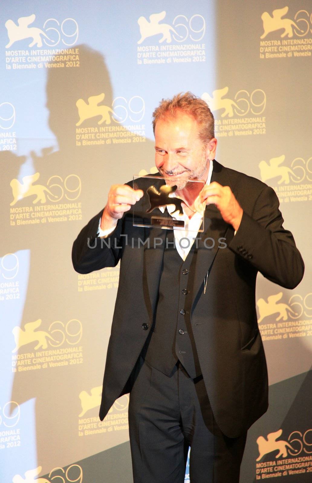 Ulrich Seidl poses for photographers at Venice Film Festival