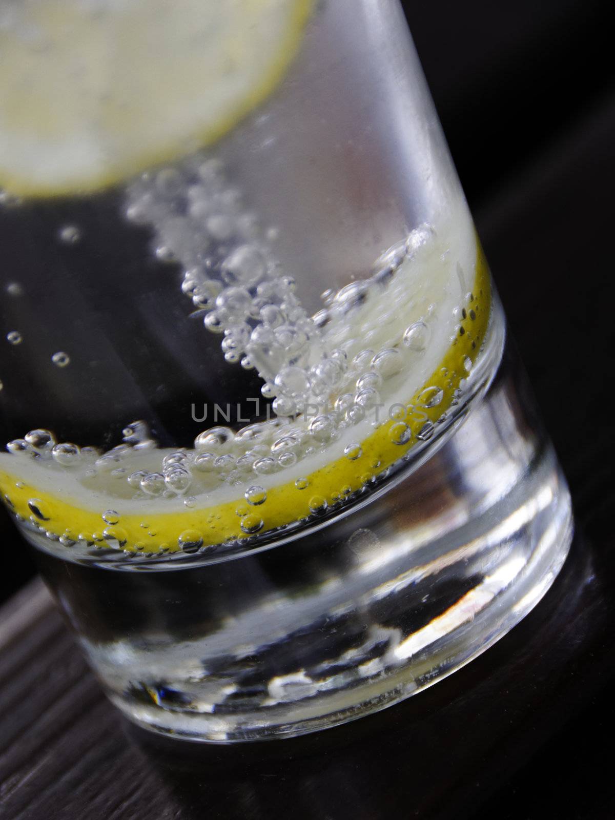 Glass of sparkling water with a slice of lemon