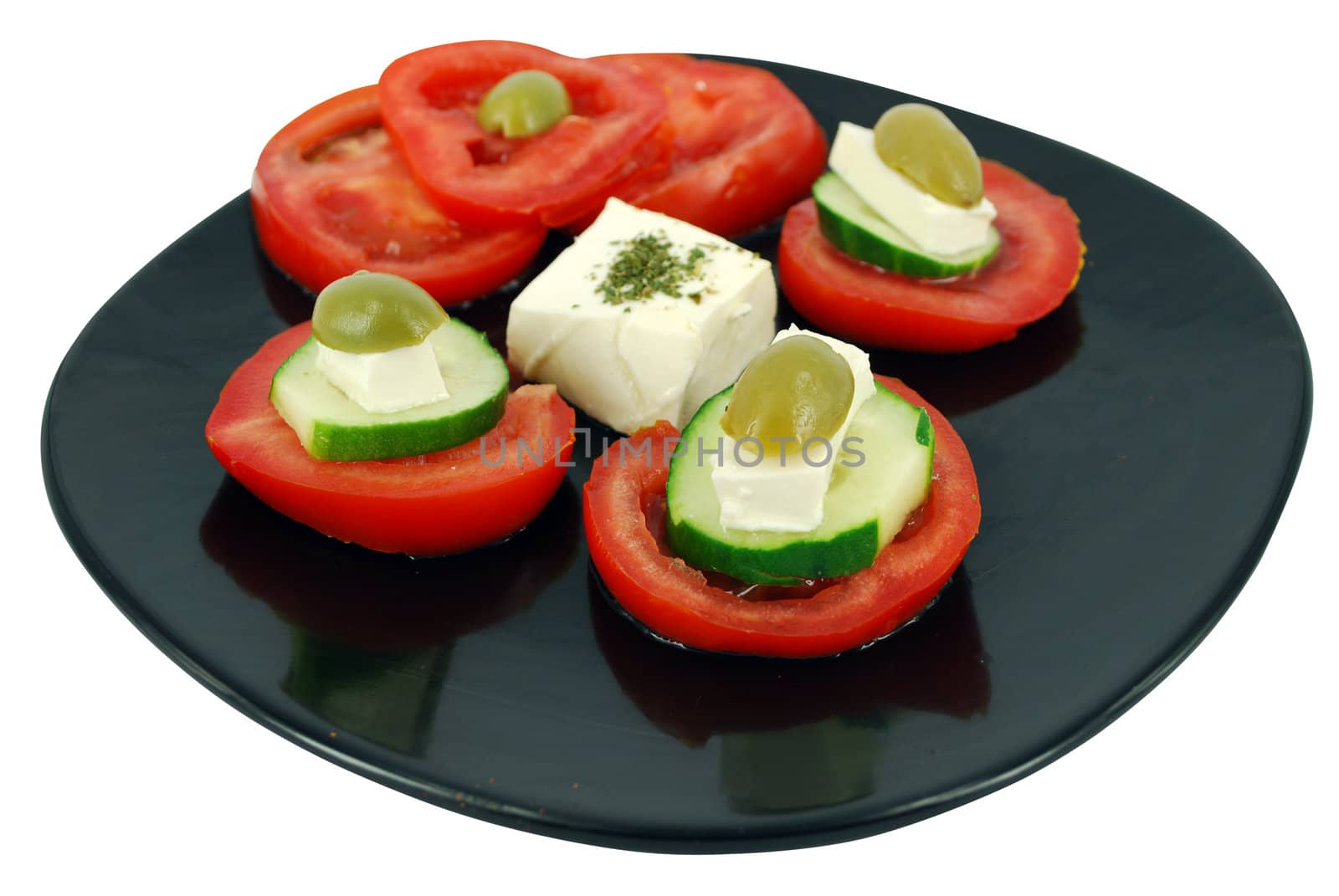 Decorative salad with cheese,olives,tomatoes and cucumber
