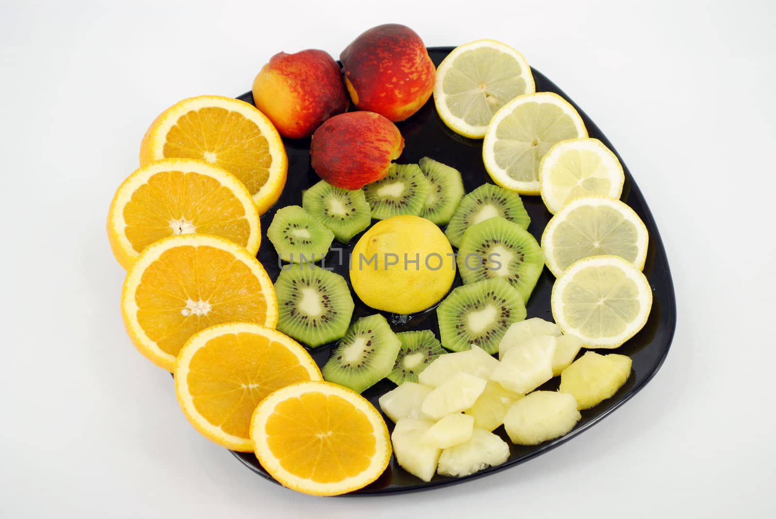 Fresh fruit on black dish