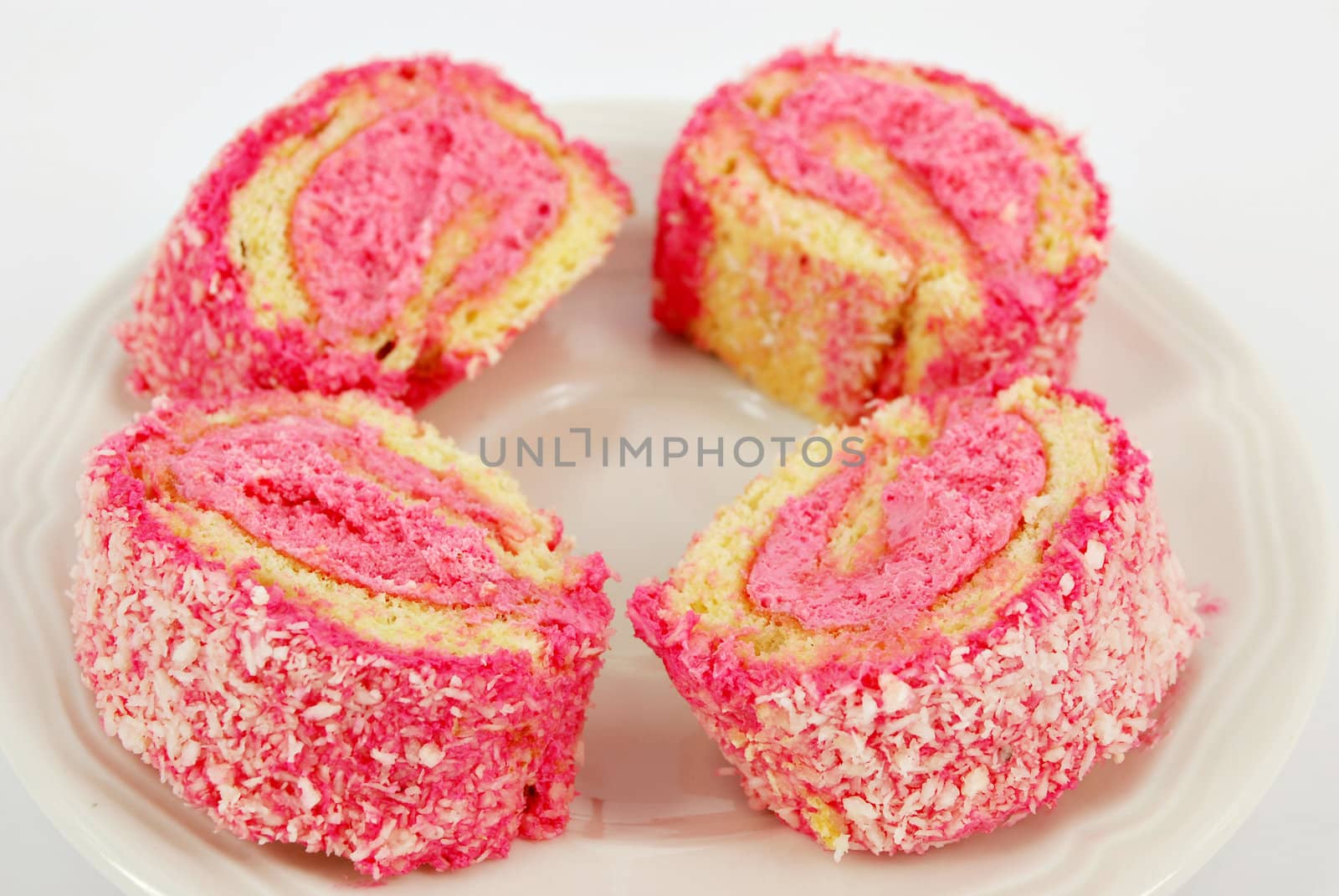 Pink roll cake with coconut