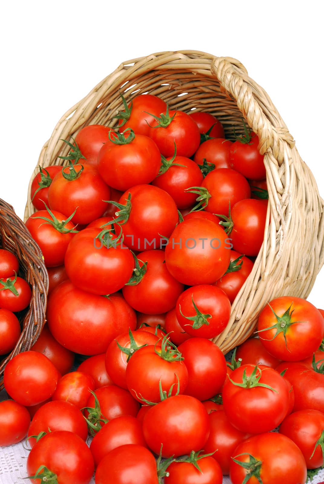 Basket with tomatoes on white