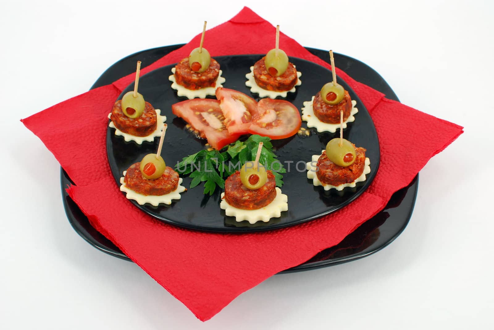 Decorative party food on black dish