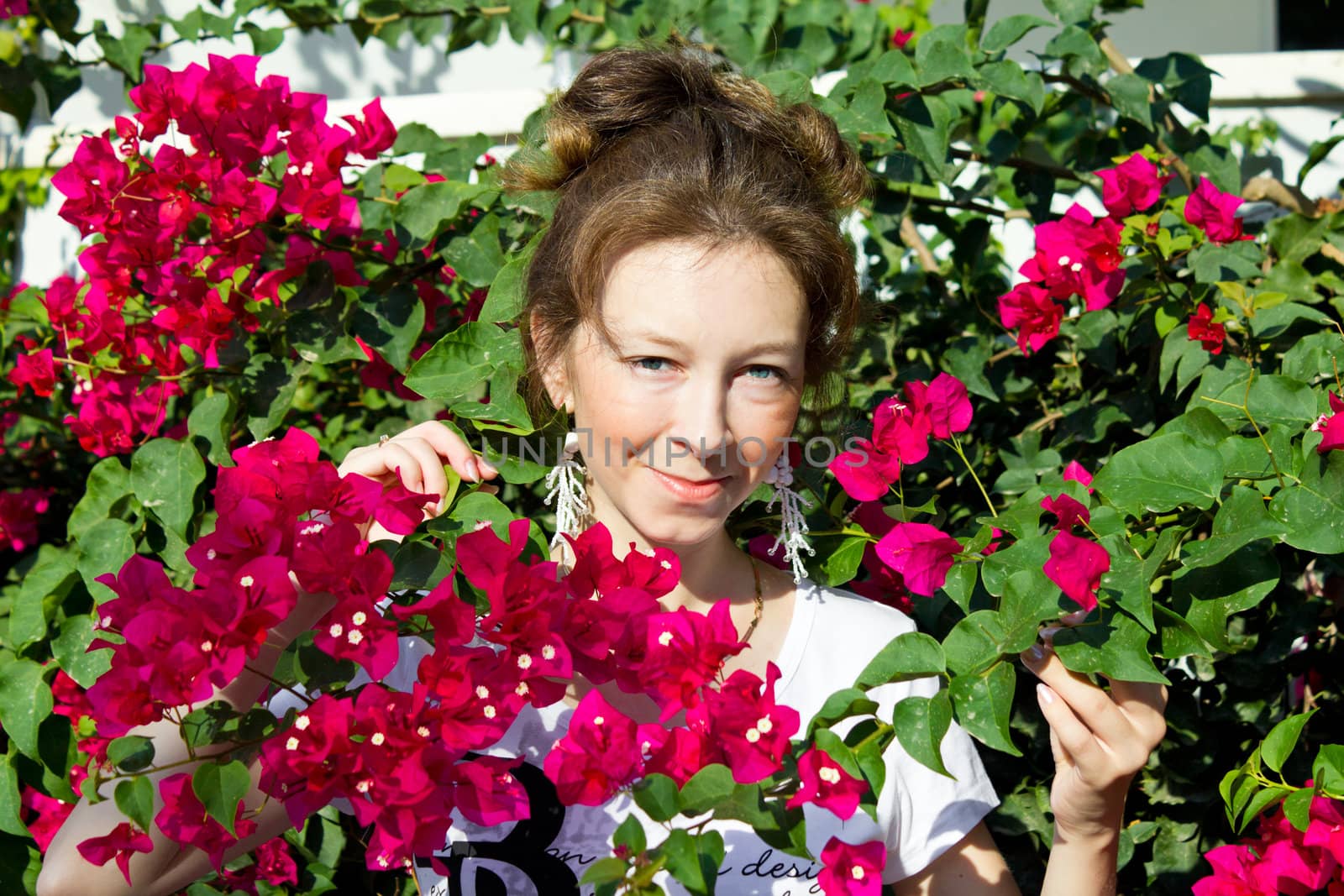 Girl at the park with pink flowers