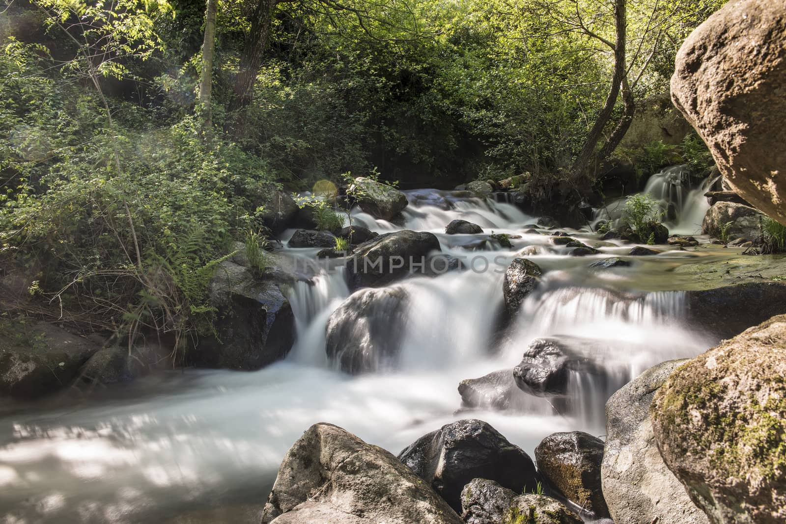 Mountain river with cascades by angelsimon