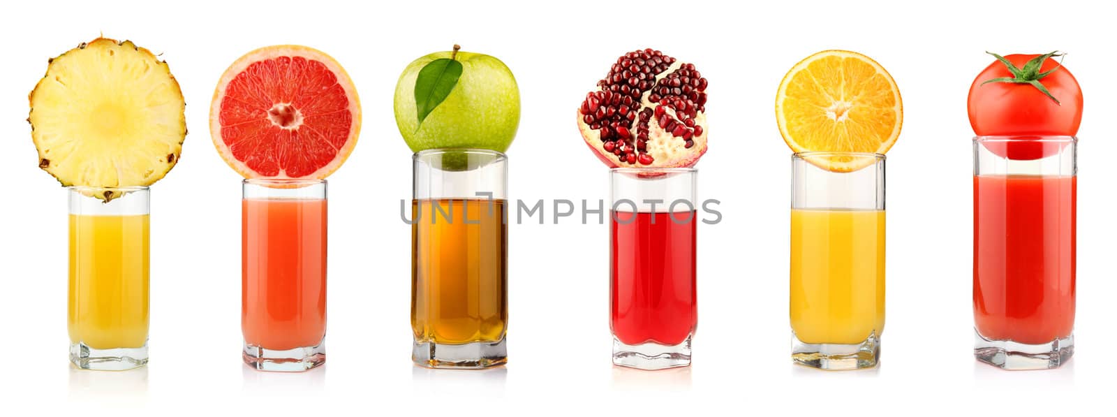 Set of tropical fruit juices in glasses isolated on white background