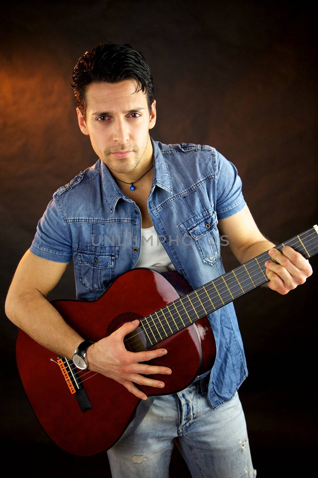 Serious male model with guitar