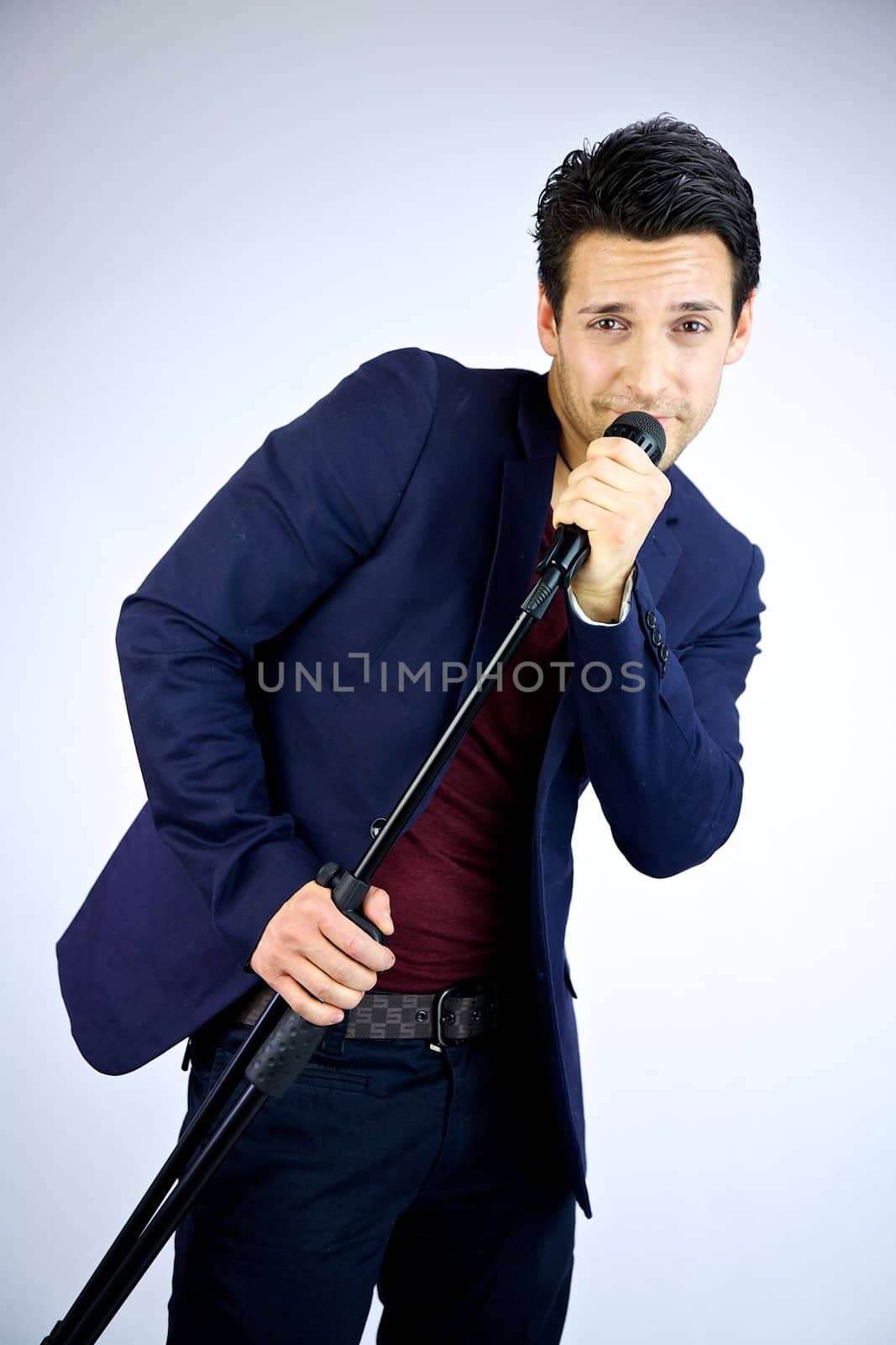 Man singing into microphone laughing by fmarsicano