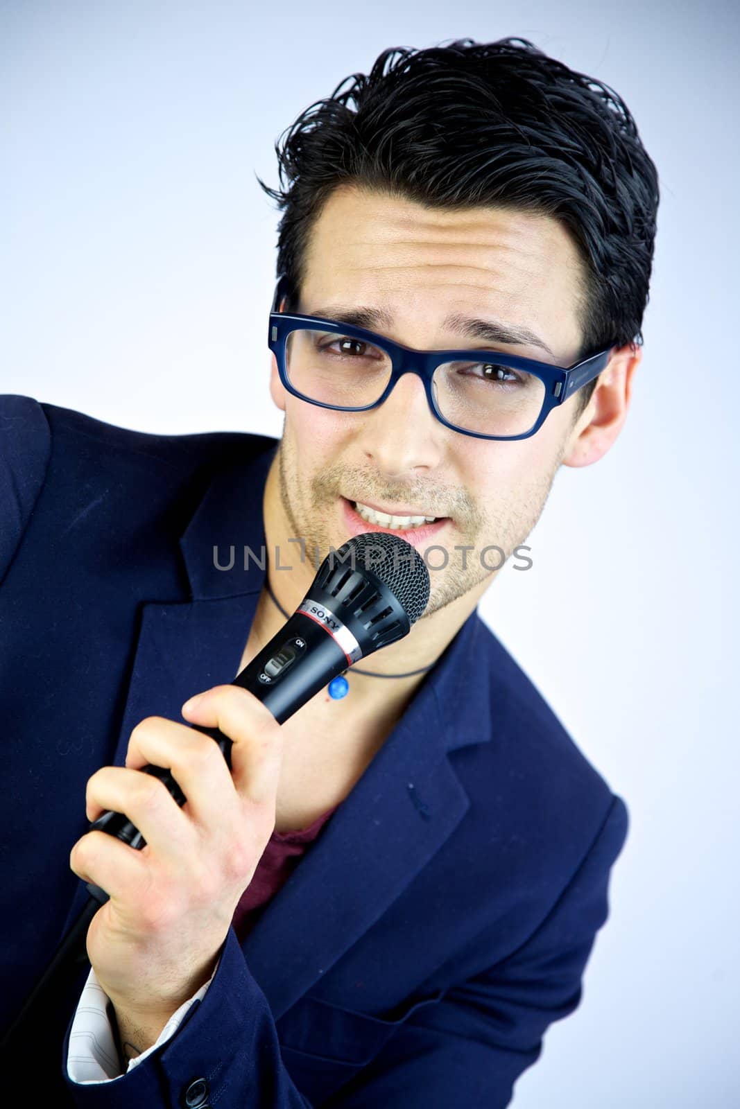 Man singing happy smiling into microphone