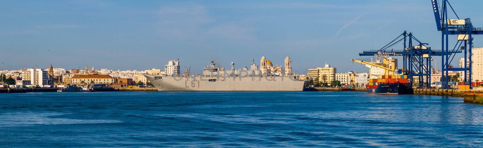 CADIZ, SPAIN-JUN 04: Aircraft carrier L-61 Juan Carlos I setting sail after taking part in an exhibition on the day of the spanish army forces on Jun 04, 2012, in Cadiz, Spain