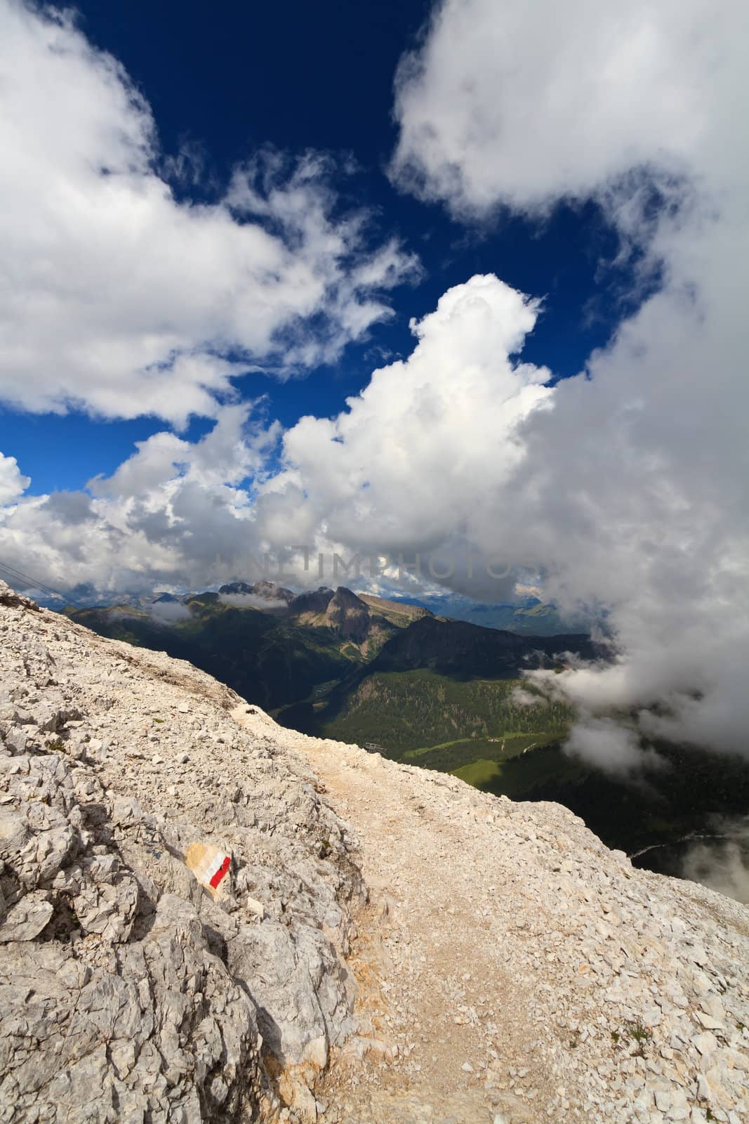 footpath between clouds in Primiero valley, Trentino, Italy