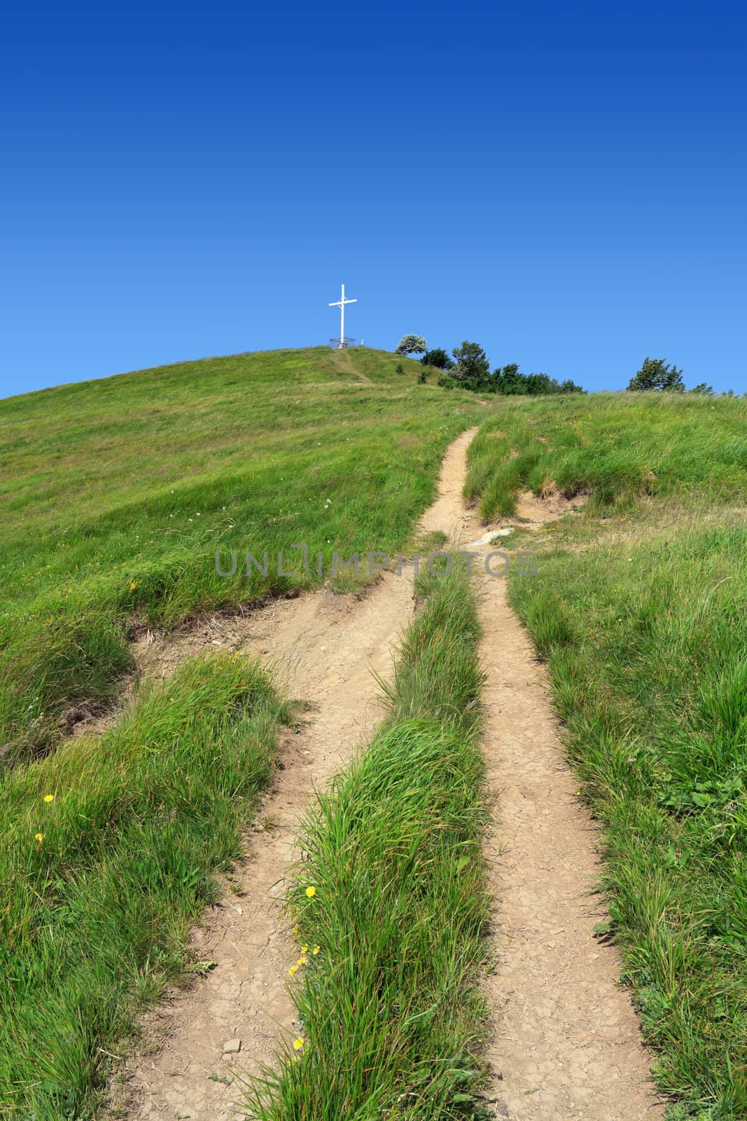 footpath and cross in Antola mount, Liguria, Italy