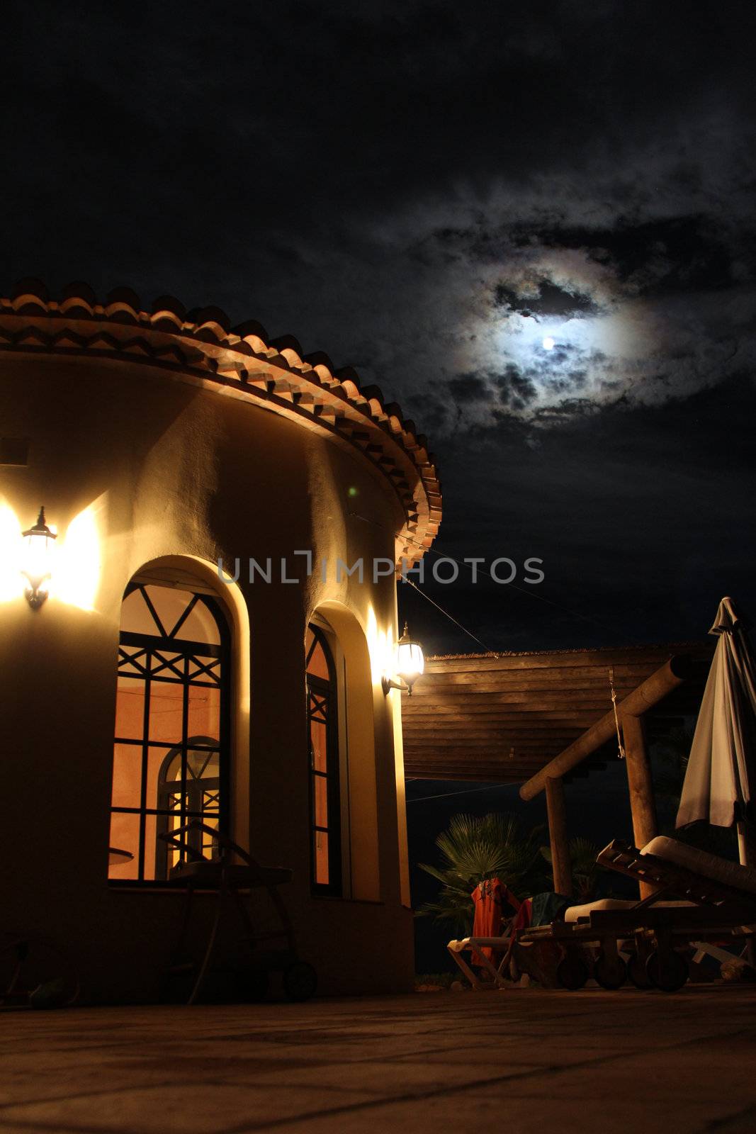 south sea facade with nice lights, palms and pool