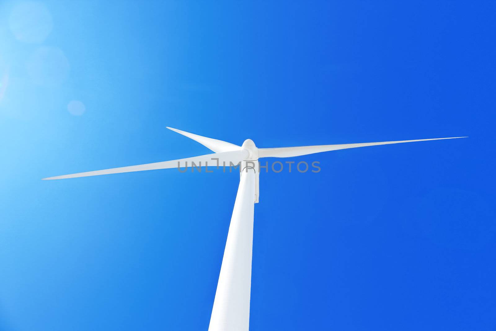 Wind turbine  at blue sky. by NickNick