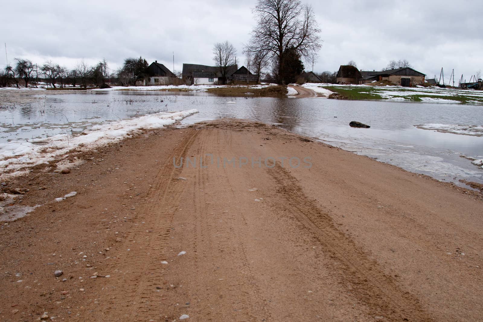 Floaded road at springtime in a contryside