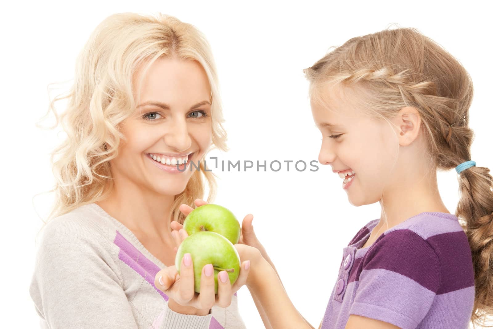mother and little girl with green apple by dolgachov