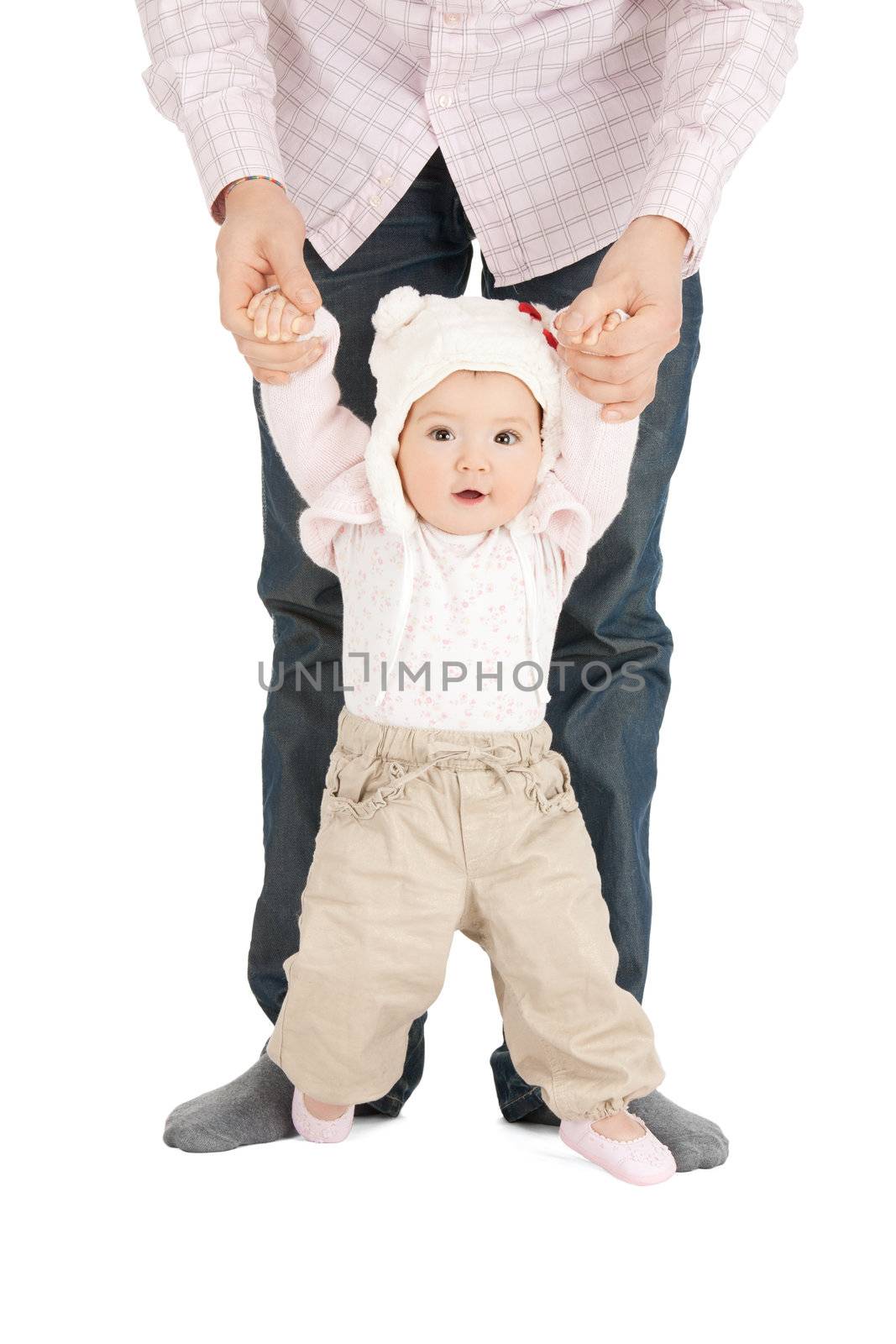 picture of baby making first steps with father help