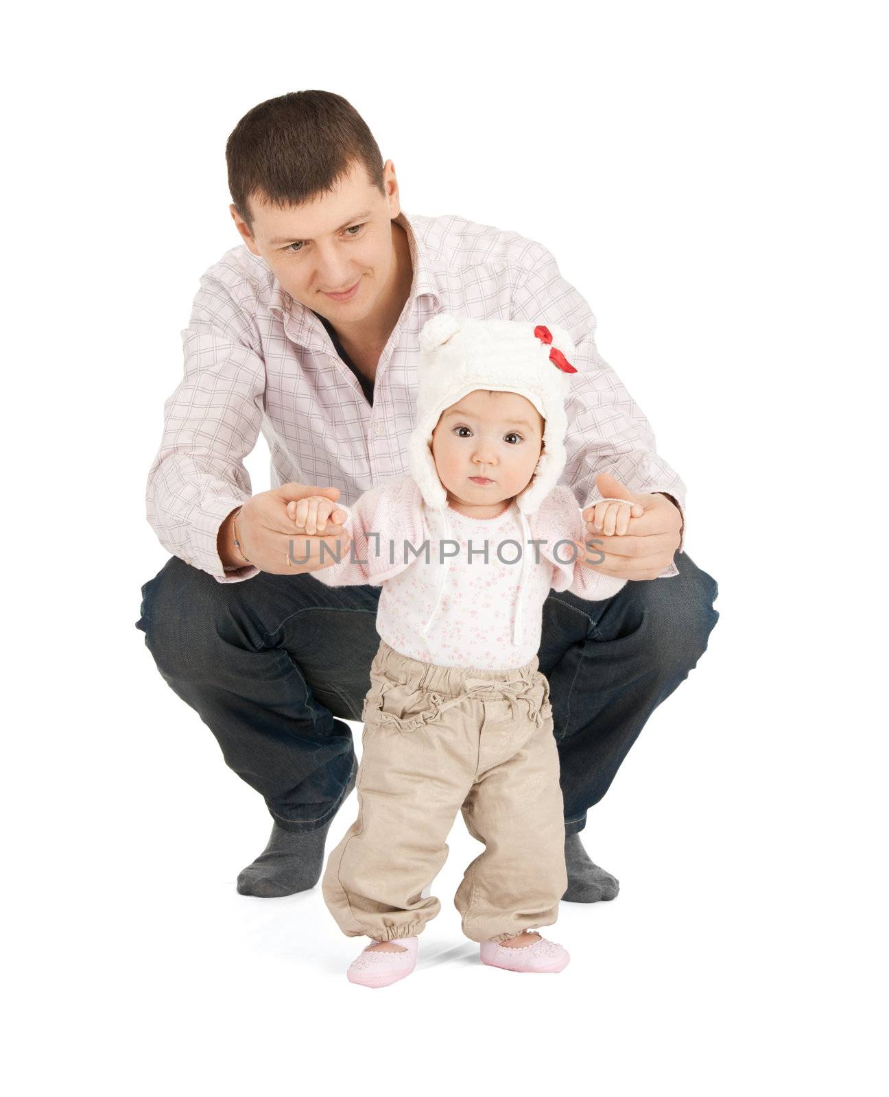 picture of baby making first steps with father help