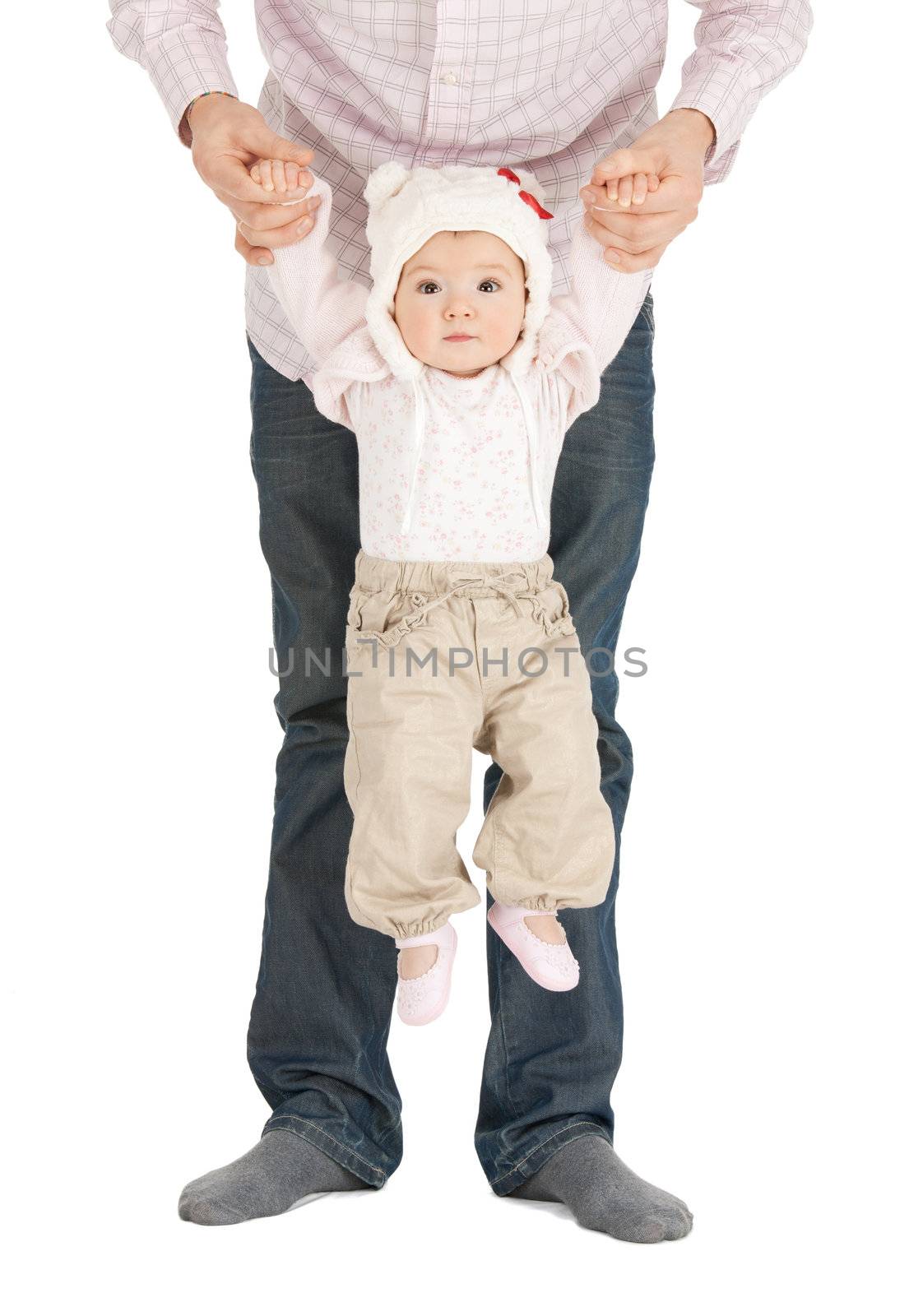 baby hanging on fathers hands by dolgachov