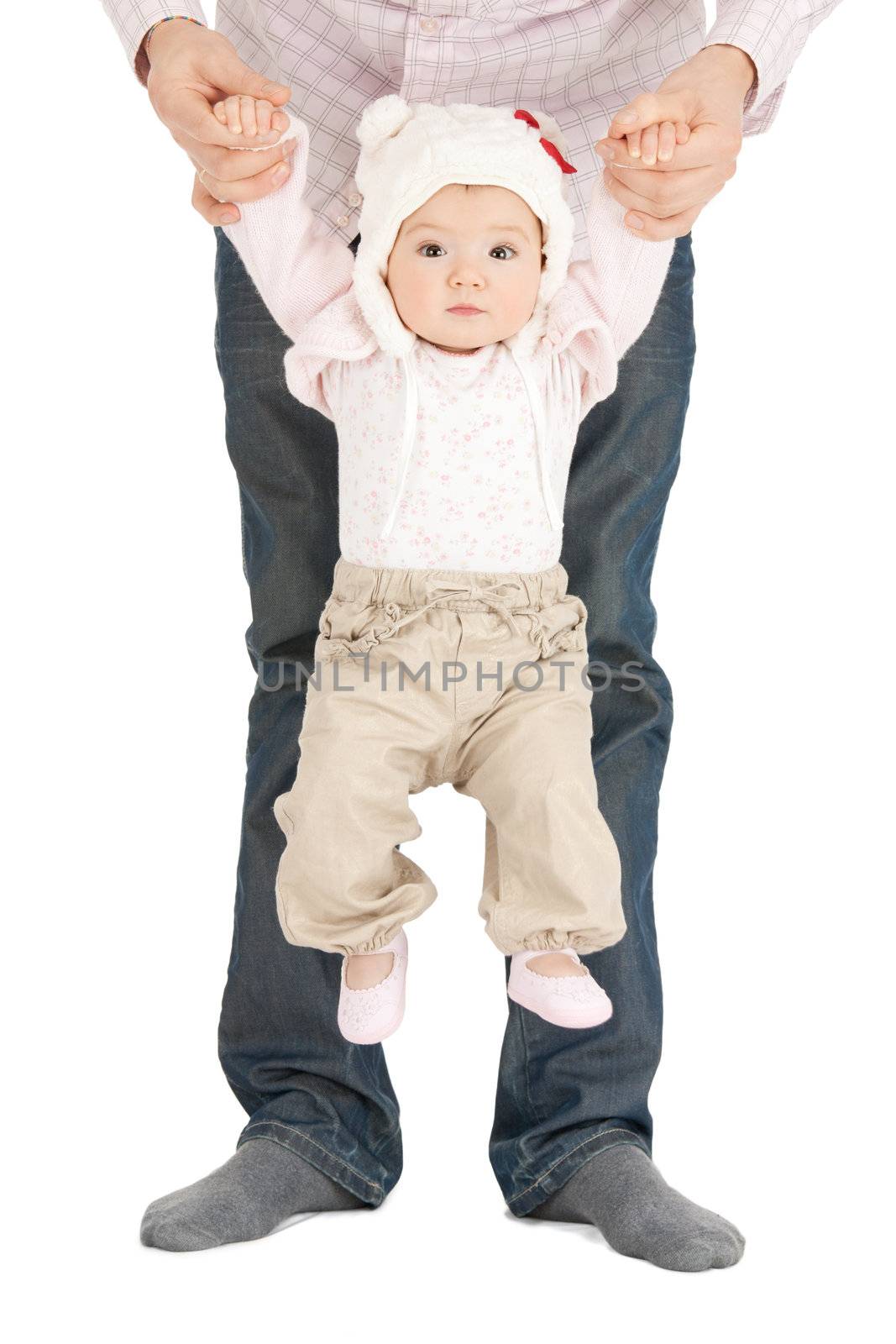 picture of baby hanging on fathers hands
