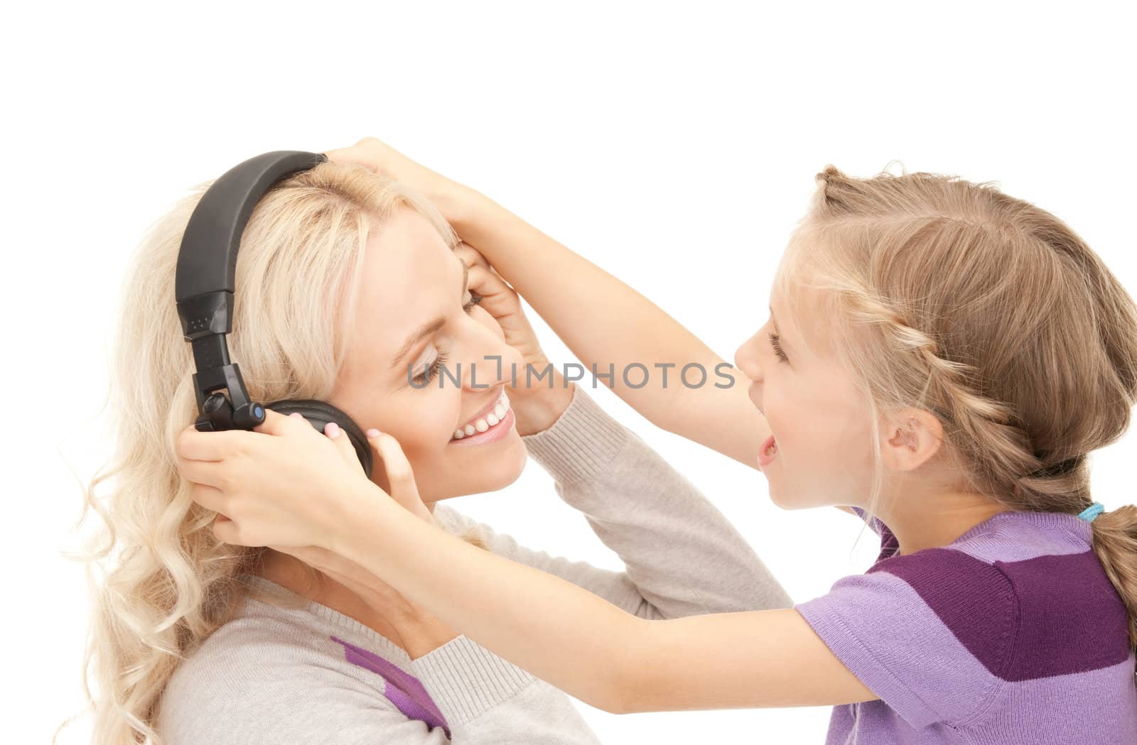 picture of mother and little girl with headphones.