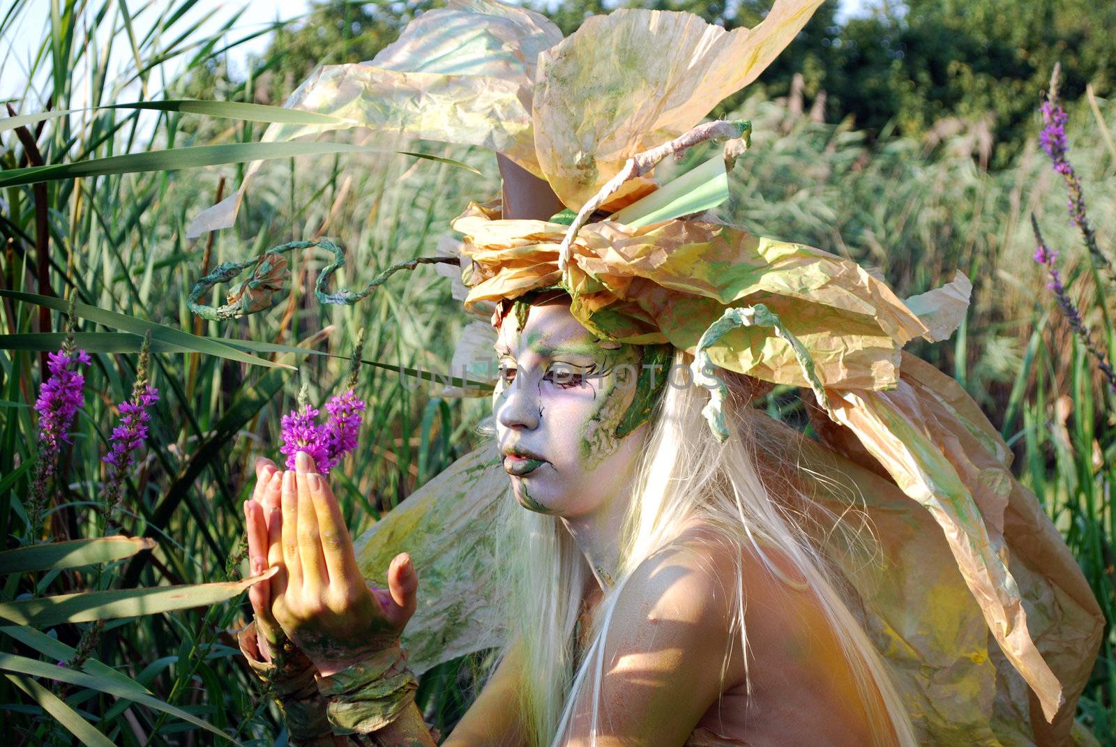 Fairy girl with flower face and body paint