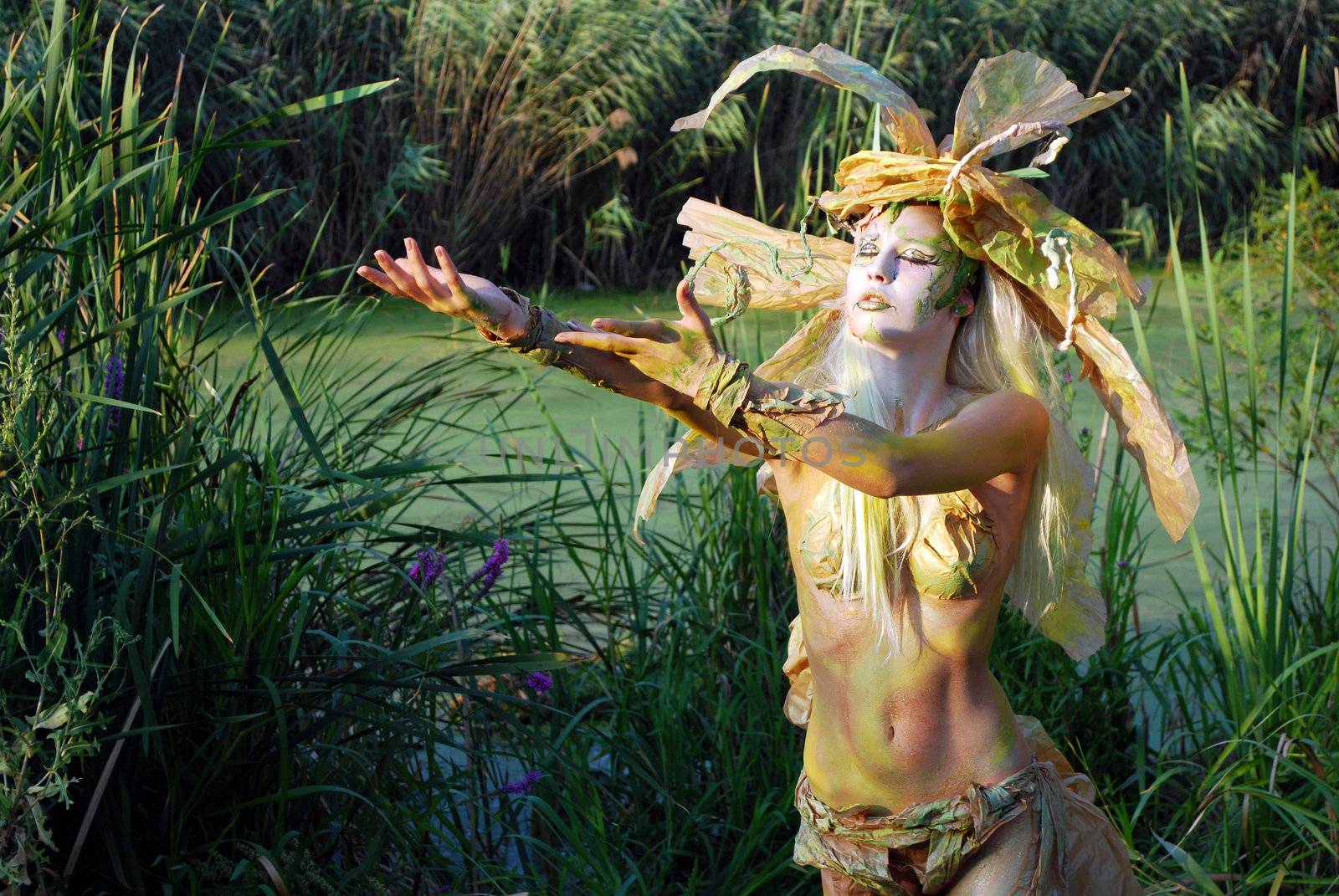 Girl face and body painting fairy forest willow pray