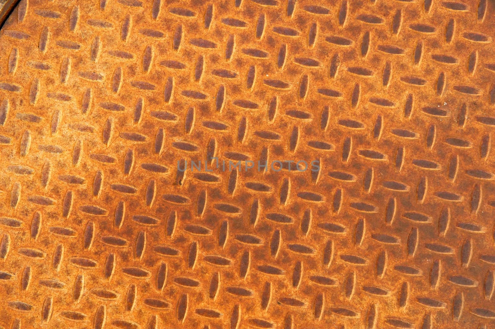 Rusted Metal Manhole Cover with Herringbone Pattern by pixelsnap