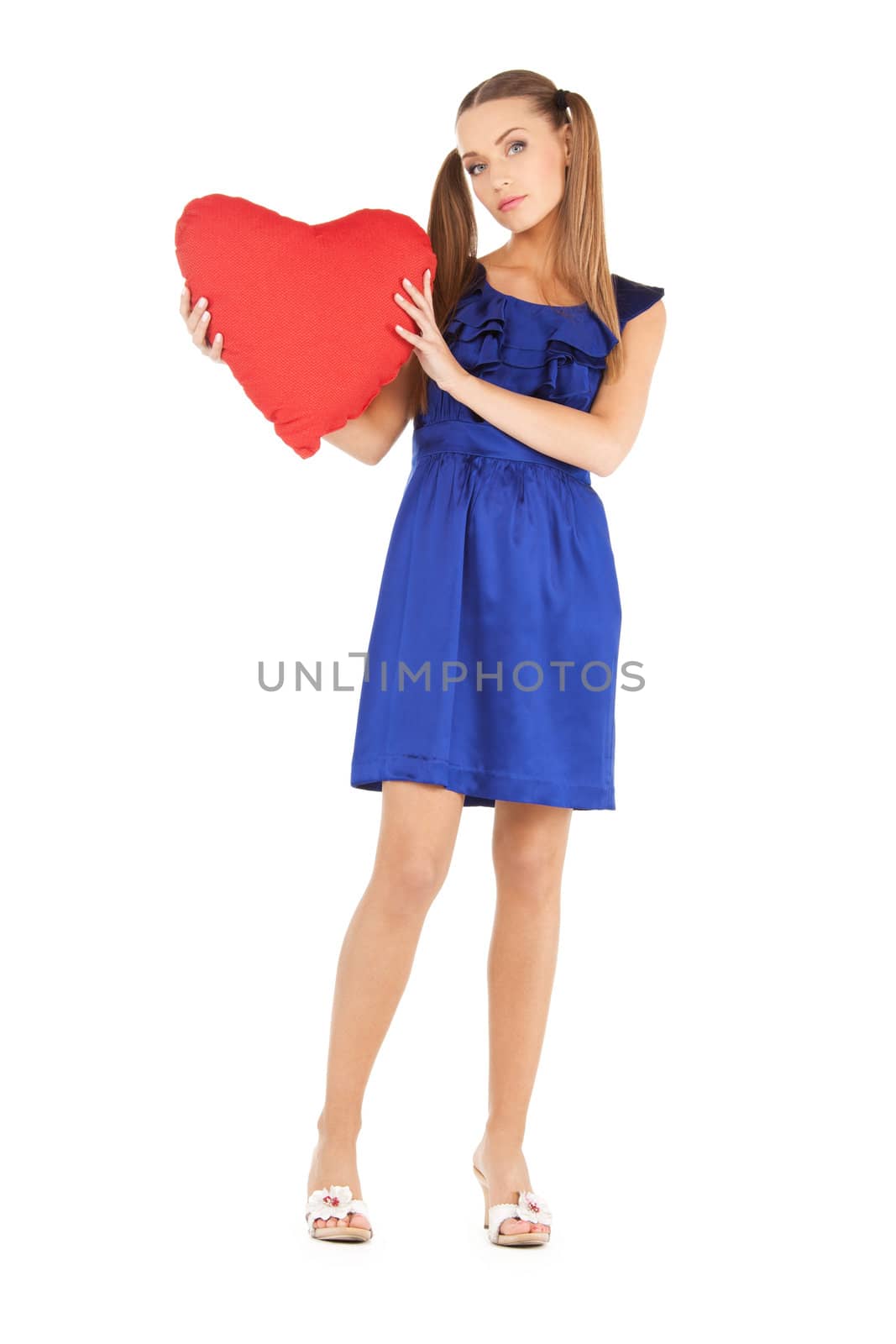 picture of lovely woman with red heart-shaped pillow