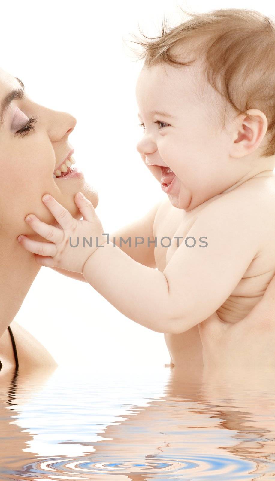 picture of happy mother with baby boy in water