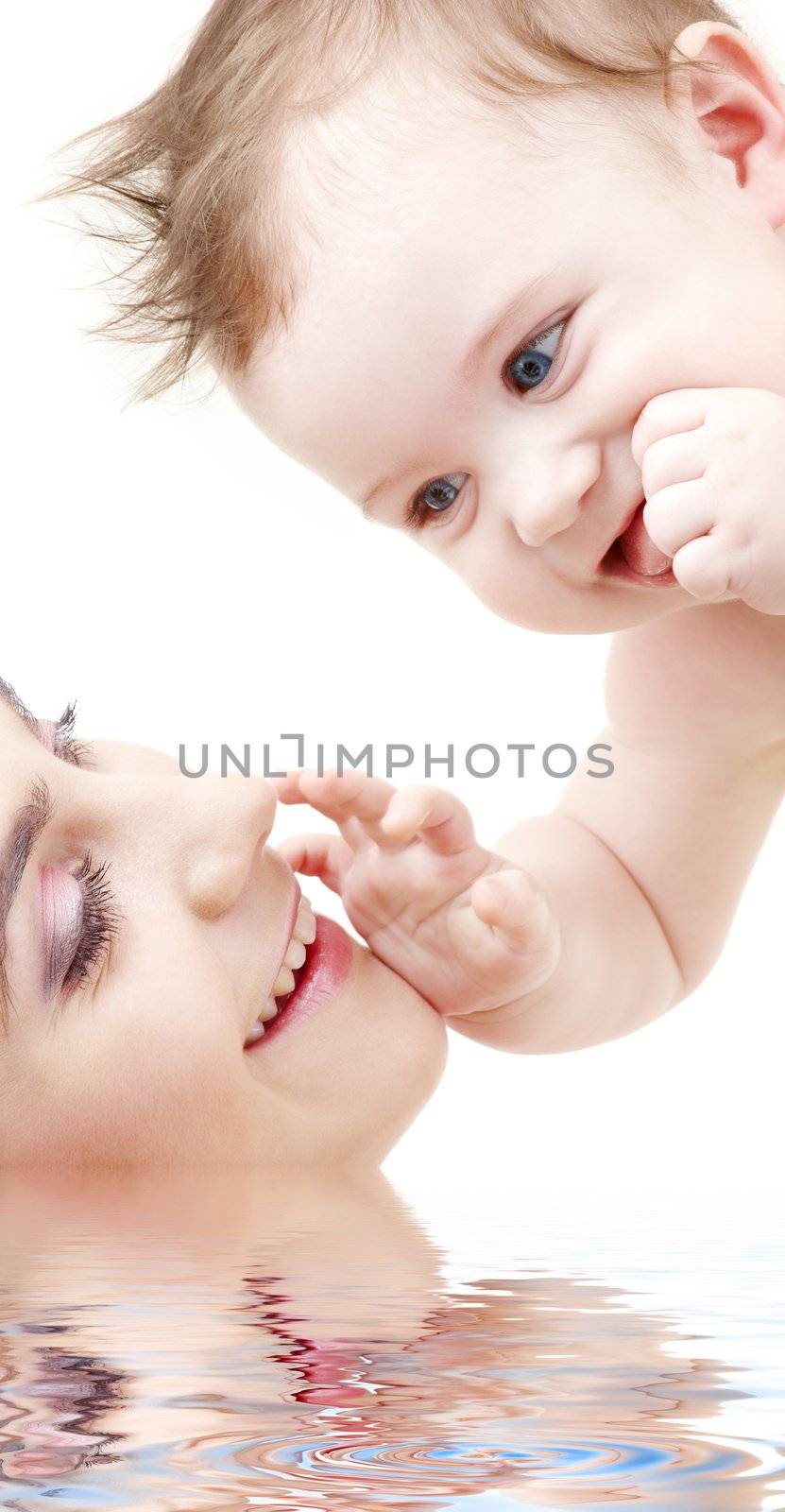 picture of happy blue-eyed baby boy touching mama