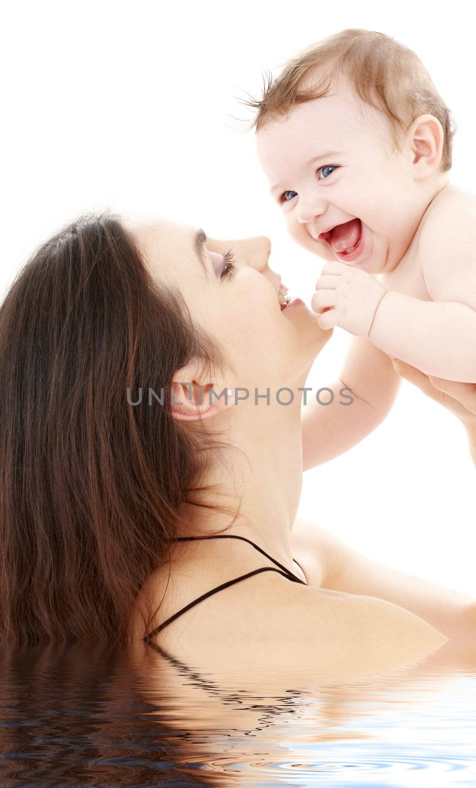 laughing blue-eyed baby playing with mom by dolgachov